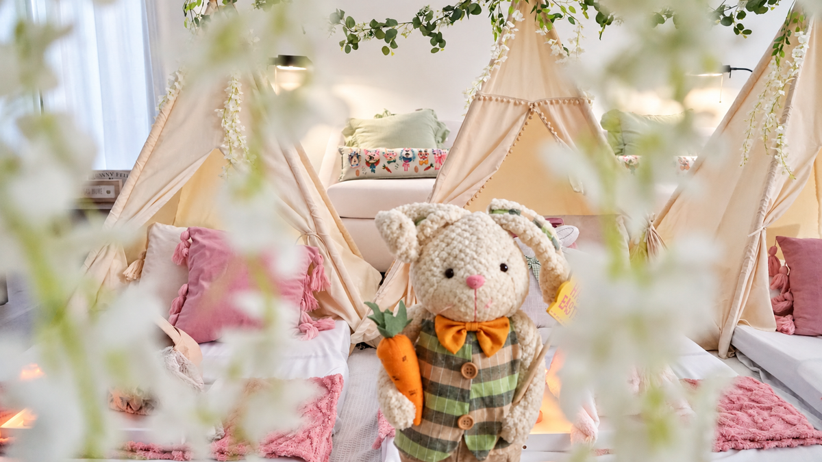 Bunny Garden teepee celebration with softly lit cream tents and pink bedding